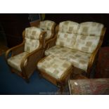 A cane and rattan framed Conservatory Suite comprising a two-seater settee,