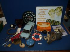 A quantity of miscellanea including gas mask, car horn, model car, New Zealand coin plaque,