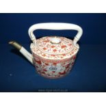 A Royal Crown Derby ''Pembroke'' Teapot in cream with rust coloured bird and floral design,