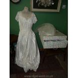 A boxed Madeline Gardner wedding dress with beading to bodice and edge of skirt,