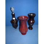 Two crimson red coloured Vases 10" tall and a crimson red Decanter with stopper in clear glass,