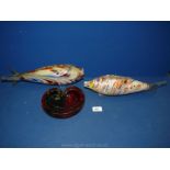Two colourful glass fish 13 1/2" and 14 1/2" long with a glass Murano style ashtray in red,