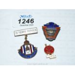 Three small metal badges including 15 Year National Savings,