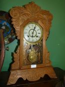 A carved Clock by New Haven clock Co.