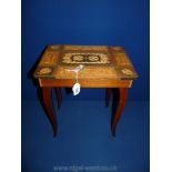 A Sorrento musical Table with marquetry top with sewing contents and key,