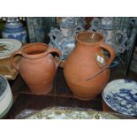 A six pint terracotta Jug, glazed interior,