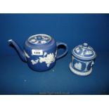 A Wedgwood Jasperware lidded pot in dark blue (crack to lid),