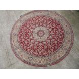 A circular Kasbah rug, red border,