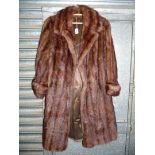 A brown 'mink style' three quarter length coat with three quarter length sleeves,
