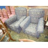 A pair of circa 1910 lady's and gentlemen's fireside Chairs re-upholstered in navy blue and beige