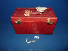 A vintage ladies vanity case in red leather and darker lining with internal pockets and keys,