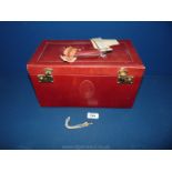 A vintage ladies vanity case in red leather and darker lining with internal pockets and keys,