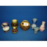A small quantity of pottery items including small vases and jug.