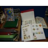 A quantity of Stamp books and folders with stamps from Dubai, New Zealand, Malaysia, Malta, Japan,