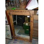 A heavy wooden carved Mirror with column sides.