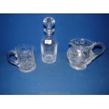 A cut glass Decanter with stopper, cut glass water jug and tankard.