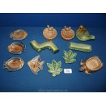 A quantity of Wade trinket dishes, dog pipe holder, squirrel dish, fishes etc.
