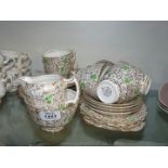 A green clover and gold twenty-one piece Phoenix bone china part Teaset including six cups,