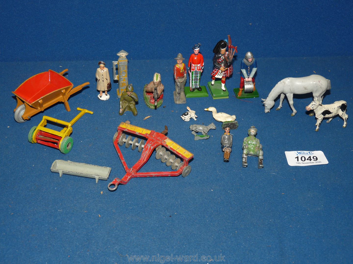 A quantity of hollow cast toys including Britain's, agricultural, Dinky , animals, garden tools,