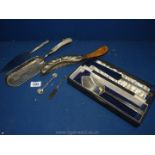 A cased Walker & Hall plated serving spoon and cake knife, crumb tray, cake slice,