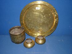 A large brass Charger 16" diameter, a jardiniere and two pots in Middle Eastern design.