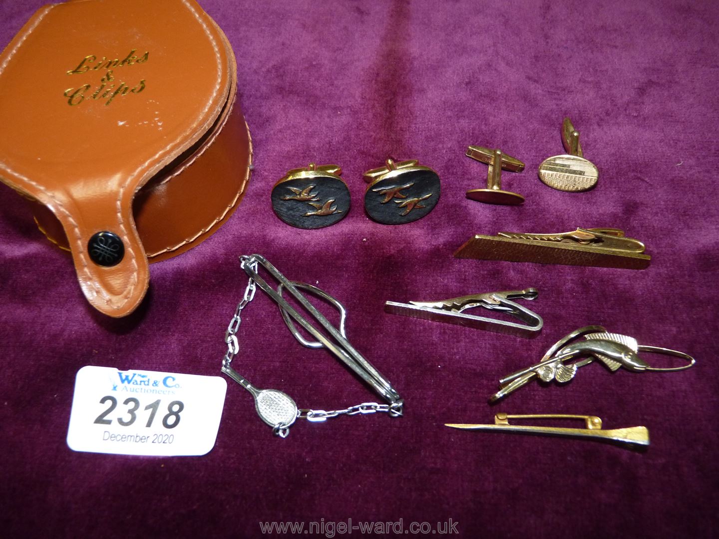 A Links box and contents including a pair of rolled gold cuff links, nail style stick pin,
