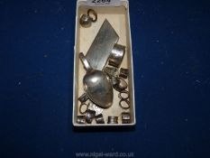 A small quantity of scrap silver including spoon, cutlery collars etc.