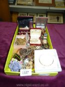A quantity of costume jewellery: brooches, chains, beads, earrings, watches.