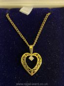 An H. Samuel 9ct gold pierced heart pendant set with white stone with chain necklace, 17 1/2'' long.