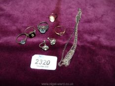 Three silver rings, a pair of clip on ear -rings, small gold ring and a cameo ring.
