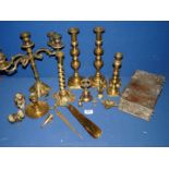 A quantity of brass including candlesticks with pushers, candelabra, wise monkey, chamber stick etc.