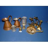 A quantity of brass, copper and pewter including ale jugs, wall candle sconces, chamber stick,