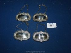 A set of four Georgian style silver decanter labels: Brandy, Whisky, Sherry and Port,