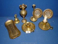 A quantity of brass to include two chamber sticks, bell, ornate vase, etc.