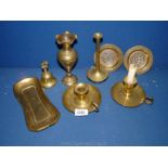 A quantity of brass to include two chamber sticks, bell, ornate vase, etc.