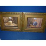 A pair of Still Life prints, unsigned, depicting vases on a table.