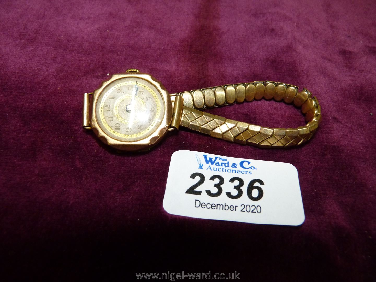 A Ladies 9ct gold Swiss made wristwatch with elasticated strap, London hallmarked.