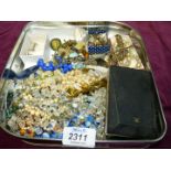 A box of mixed costume jewellery including brooches, clip-on earrings etc.
