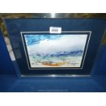 A framed and mounted watercolour of a landscape with buildings on a hillside,