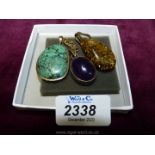 Three pendants, one with turquoise stone,