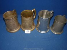 Four brass/white metal tankards with glass bases.