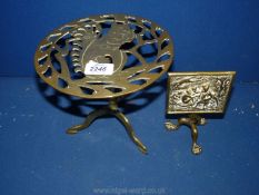 Two brass trivets both with spade legs, one with squirrel decoration the other with folding top.
