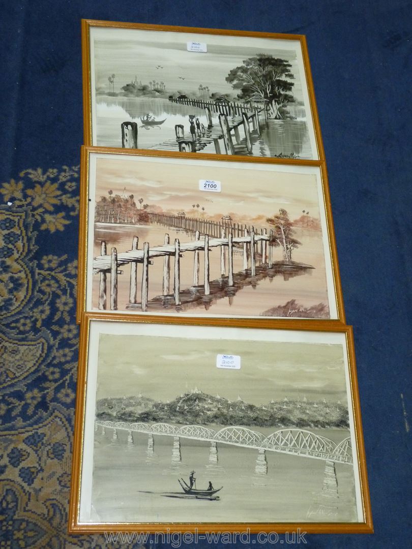 Three framed oriental prints of various landscapes, indistinctly signed lower right.