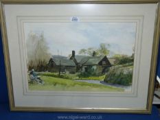 A framed and mounted Watercolour depicting an artist sat painting an old water mill,