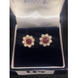 A pair of 9ct ruby and cultured pearl earrings