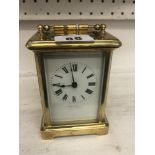 A brass cased Finnigans carriage clock