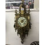 A French gilt brass wall clock circa 1900