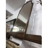 A walnut over mantle mirror