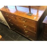 A 19th century mahogany, inlaid two over three chest of drawers.