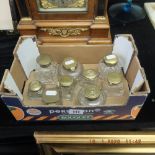 Nine brass lidded glass inkwells